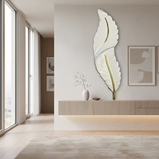 White feather-shaped object with gold accents on a black background